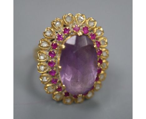 A yellow metal, amethyst, ruby and rose cut diamond set oval dress ring, with diamond set shoulders, size M, gross 10.1 grams