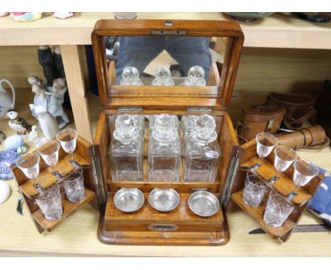 A Victorian oak-cased decanter / games box, height 33cm