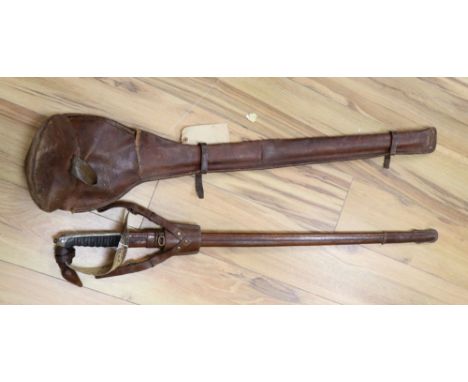 A Wilkinson George V officer's sword with sheath and leather case, serial no.24302