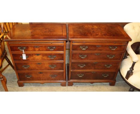 A pair of Georgian style banded walnut chests, each fitted brushing slide over four graduated long drawers on bracket feet, W