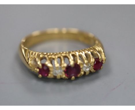 A late Victorian 18ct gold, ruby and diamond five stone ring, size I, gross 3.6 grams.