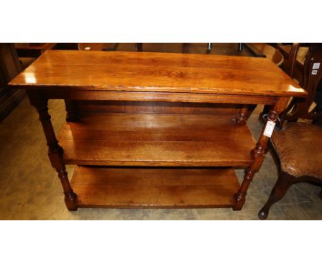 A three tier oak buffet, W.116cm, D.40cm, H.84cm