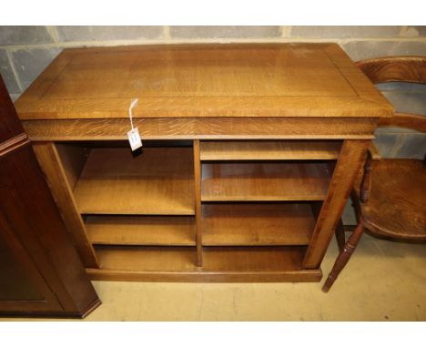 A modern light oak open bookcase, with adjustable shelves, W.110cm, D.52cm, H.90cm
