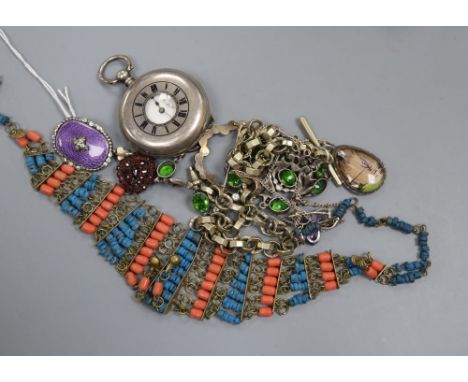 A 1950' silver, enamel and paste set brooch, a green paste necklace and other jewellery, including a Victorian garnet set hea