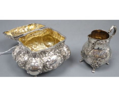 An early 20th century German embossed 835 white metal bombe shaped tea caddy with rose finial, height 10.8cm and a similar cr