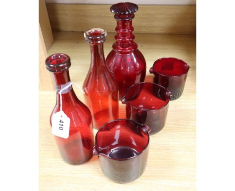Two ruby glass carafes, three rinses and a decanter
