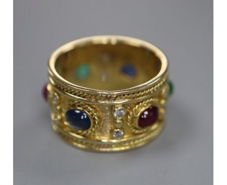 A modern yellow metal, diamond and cabochon ruby, sapphire and emerald set band, signed 'Alex', size S, gross 11.4 grams.