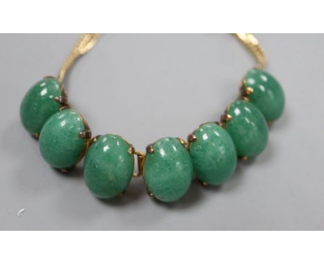 A 14k yellow metal and simulated cabochon jade set bracelet, 18.3cm, gross 33.4 grams.