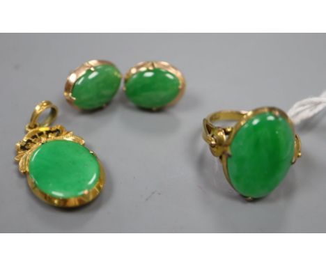 A Chinese yellow metal and jade oval ring, size K, gross 4.2 grams, an 18ct and jade pendant, overall 31mm, gross 2.8 grams a
