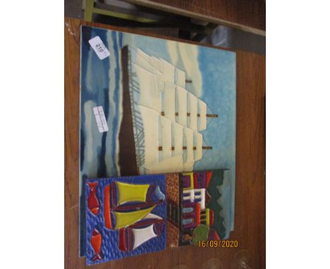 TWO DECORATIVE CERAMIC TILES DEPICTING BOATS
