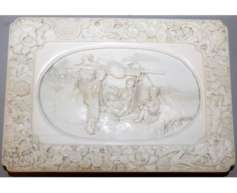 A VERY FINE QUALITY SIGNED JAPANESE MEIJI PERIOD IVORY RECTANGULAR TRAY, the inset top surface finely carved with a lady in a