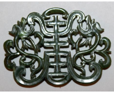 A GOOD QUALITY 19TH/20TH CENTURY CHINESE SPINACH GREEN JADE PLAQUE, carved and pierced in the form of a Shou symbol flanked b