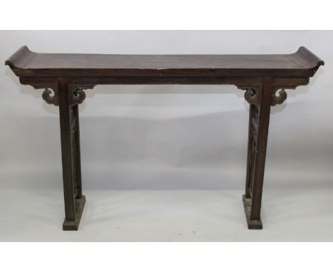 A 19TH/20TH CENTURY CHINESE HARDWOOD ALTER TABLE, the narrow top surface with scroll ends, the two pierced supports with ruyi