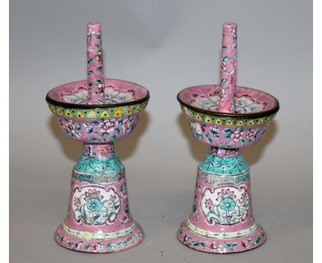 A PAIR OF 19TH CENTURY CHINESE CANTON ENAMEL PINK GROUND JOSS STICK HOLDERS, with detachable trays, 7.4in high.
