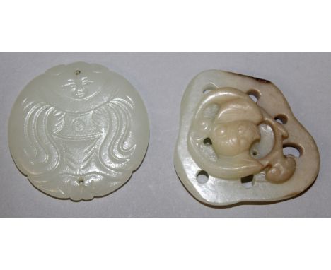 A CHINESE SHAPED & PIERCED JADE-LIKE CARVING, decorated in relief with a bat, 2.3in wide at widest point; together with a sha