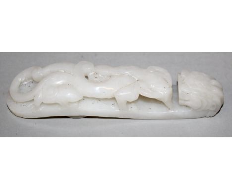 A CHINESE WHITE JADE-LIKE BELT HOOK, decorated in pierced relief with a sinuous chilong, the hook in the form of a dragon’s h