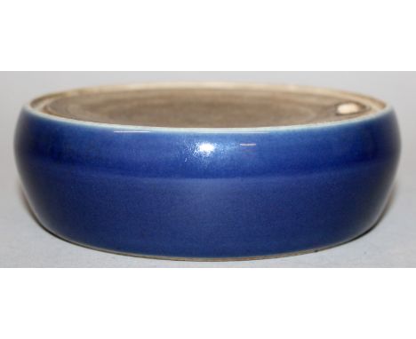 A CHINESE BLUE GLAZED WATER DROPPER, with unglazed grooved top surface and shaped aperture, possibly intended for use with an