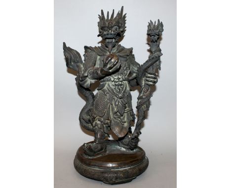 A LARGE 20TH CENTURY JAPANESE BRONZE FIGURE OF A DRAGON DEITY, standing and holding a coiled dragon staff in one hand and the