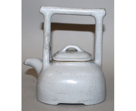 A GOOD & UNUSUAL 19TH/20TH CENTURY CHINESE BLUE GLAZED YIXING POTTERY TEAPOT, of rounded square section with an overhead hand