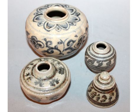 A SAWANKHALOK CERAMIC JAR, 14th/16th Century, the lobed body painted to its sides with formal scroll-stemmed flowerheads, 3.6