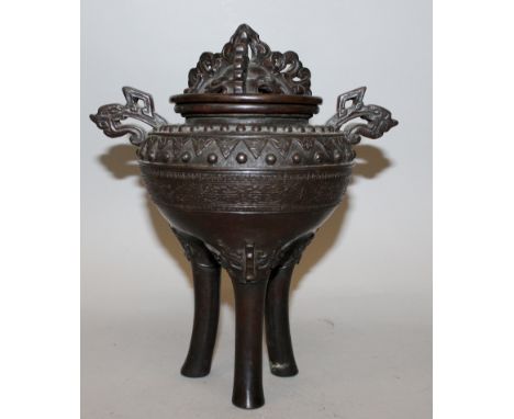 A 19TH CENTURY JAPANESE MEIJI PERIOD BRONZE TRIPOD KORO & COVER, supported on high shi-shi head feet, the sides with bands of