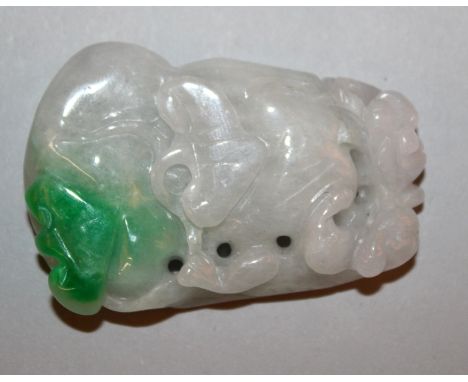 A CHINESE WHITE JADE-LIKE PENDANT, with an apple-green inclusion, and with pierced decoration in the form of a chilong, a gou