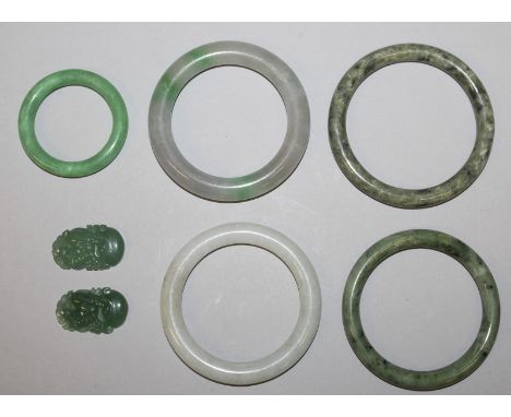 A GROUP OF FIVE CHINESE JADE-LIKE BANGLES, the largest 3.25in diameter; and a small pair of jade-like pendants, each 1.4in hi