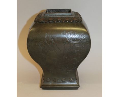 A GOOD & UNUSUAL 17TH/18TH CENTURY CHINESE BRONZE VASE, the square-section body decorated on the flaring sides with scenes of