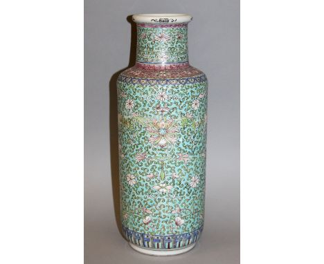 AN EARLY 20TH CENTURY CHINESE TURQUOISE GROUND FAMILLE ROSE PORCELAIN VASE, painted with a formal design of scroll-stemmed lo