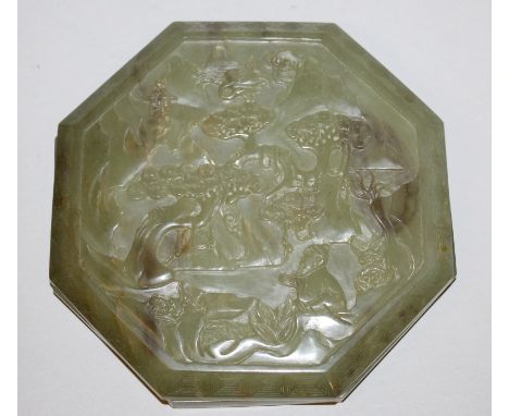 A CHINESE CELADON JADE-LIKE SHALLOW OCTAGONAL BOX & COVER, the cover decorated with a sage seated beneath a pine tree in a mo