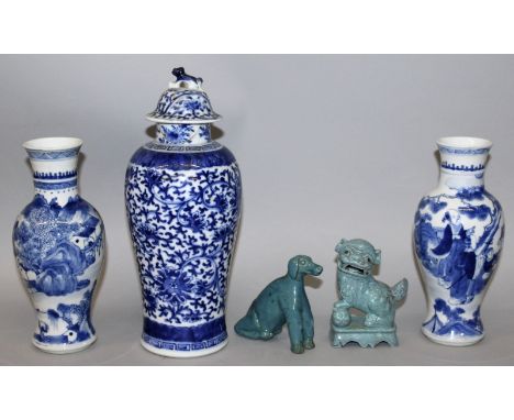 TWO SIMILAR 19TH CENTURY CHINESE BLUE & WHITE PORCELAIN VASES, each base with a four-character Kangxi mark, 7.8in high; toget