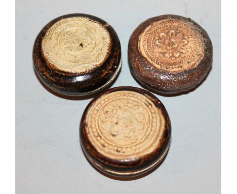 THREE SIMILAR SONG DYNASTY BROWN GLAZED MINIATURE CERAMIC BOXES & COVERS, each cover moulded with a flowerhead, the largest 1