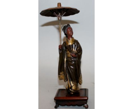 A GOOD SIGNED JAPANESE MEIJI PERIOD MIYAO TYPE PARCEL GILT BRONZE FIGURE OF A LADY, mounted on a fixed wood stand, the lady h