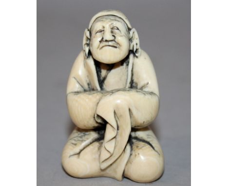 A SIGNED 19TH/20TH CENTURY JAPANESE CARVED IVORY NETSUKE, of a seated Sennin gazing upwards and dressed in flowing robes, the