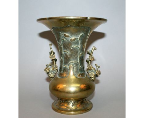 A CHINESE POLISHED BRONZE VASE, possibly 17th/18th Century, with detachable prunus handles, the waisted neck with stylised fo