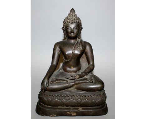 A 19TH/20TH CENTURY THAI BRONZE FIGURE OF BUDDHA, seated in meditation on a shaped triangular lotus plinth, 11.25in high.