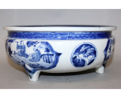 A CHINESE BLUE & WHITE PORCELAIN BOMBE PORCELAIN TRIPOD CENSER, decorated with barbed quatrefoil figural panels alternating w