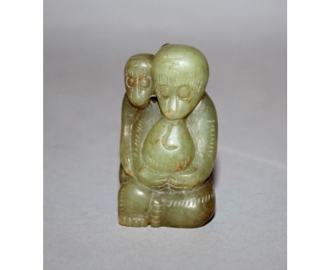 A SMALL CHINESE GREEN JADE MODEL OF A MONKEY & ITS YOUNG, the details etched, 2in high.