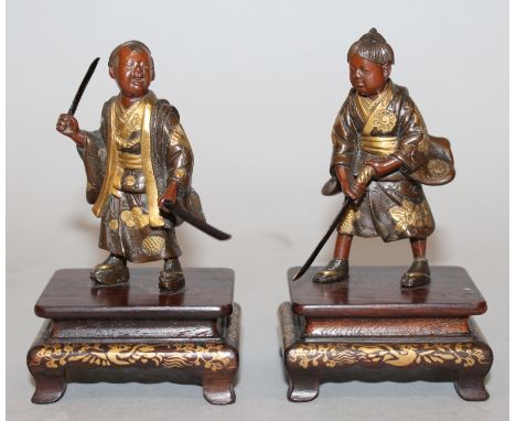 A GOOD & UNUSUAL SMALL PAIR OF SIGNED JAPANESE MEIJI PERIOD EISUKE MIYAO PARCEL GILT BRONZE FIGURES OF BOY SAMURAI, each moun