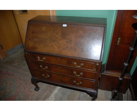 A late Victorian Mahogany Bureau, having plain top, the moulded edge fall opening to reveal eleven pigeon holes over two shor