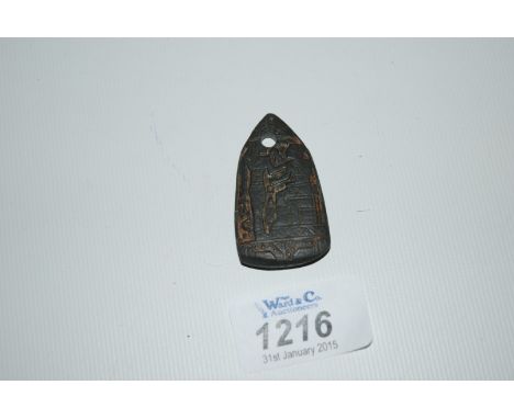 An ancient Egyptian carved black stone amulet carved hieroglyphs and images of deities in relief. Probably New Kingdom. 2 7/8