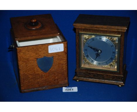 A wooden Mantle Clock by Elliott plus a wooden Tea Caddy with china liner