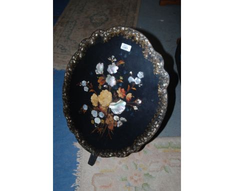 A black papier mache Fire screen, inlaid with mother of pearl