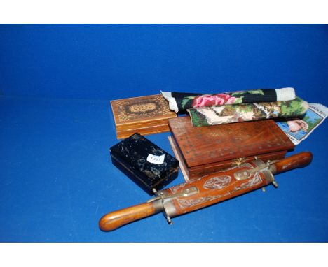 A carving set in a wooden sheath together with a set of three wooden boxes including a playing cards lacquered box with the c