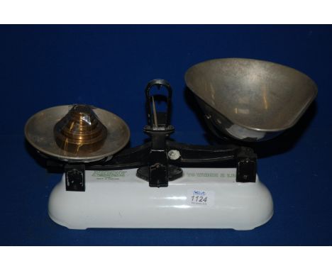 A white Avery Scales and Brass weights up to 2lbs.