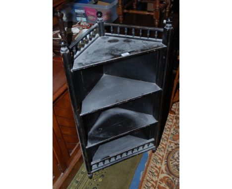 A late Victorian ebonised corner open Shelf unit, having spindle moulded gallery with ball finials, four triangular shelves, 
