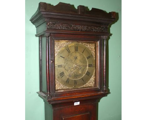 An early Georgian Oak country Longcase Clock, the fret cut top over applied moulding frieze to the head with single pane glaz