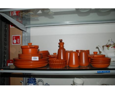A part Dinner Service in 'Honiton Devon' pattern comprising Soup Plates, Mugs, Egg Cups, Vinegar Bottle, Cruet, etc.