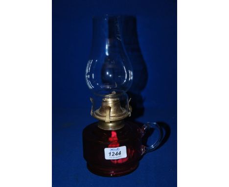 A small Cranberry glass Oil Lamp
