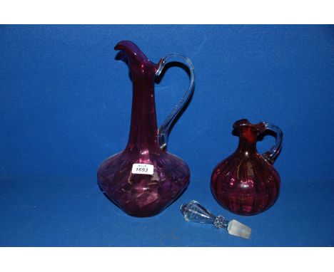 Two pieces of Cranberry glass, one being a Decanter with stopper, the other an Ewer